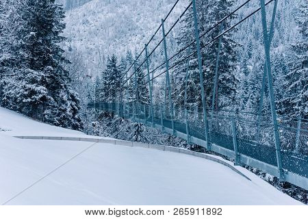 Pedestrian Suspension Bridge In Sattel Lucerne Region Switzerland. Winter Landscape.