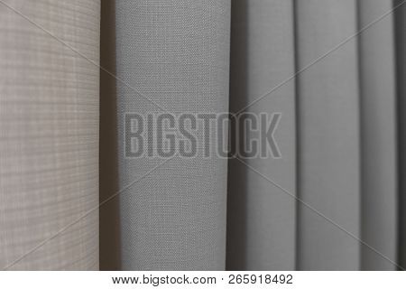 Close-up View Of Bright Curtain In Thin And Thick Vertical Folds Made Of Dense Fabric.textured Abstr