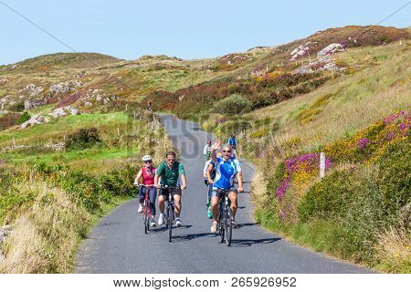 Clifden, Ireland - August 17, 2012: Unidentified Cyclists Riding Along The Sky Road, Near Clifden In