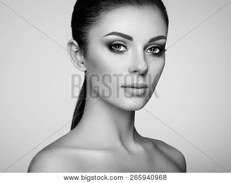Beautiful Young Woman With Clean Fresh Skin. Perfect Makeup. Beauty Fashion. Eyelashes. Cosmetic Eye
