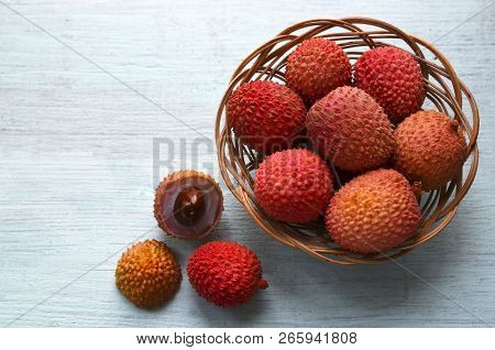 Fresh Organic Lychees In A Basket On A Light Blue Wooden Background.exotic Tropical Lichi Fruits.raw