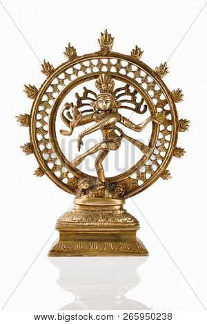 Bronze statue of indian hindu god Shiva Nataraja - Lord of Dance isolated on white with reflection