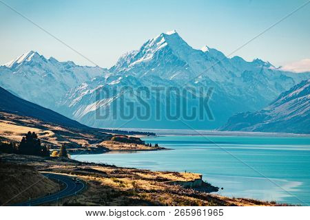 Road to Mt Cook, the highest mountain in New Zealand. Scenic highway drive along Lake Pukaki in Aoraki Mt Cook National Park, South Island of New Zealand.