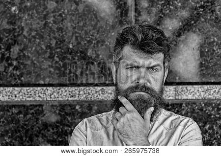 Man With Beard And Mustache On Concentrated Face, Black Marble Background. Masculinity Concept. Hips