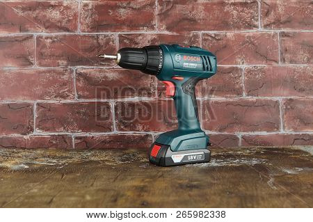 Moscow, Russia, August 18, 2018. 18v Lithium-ion Cordless Drill-drivers Bosch Gsr 1800-li On A Woode