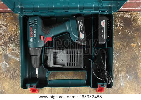 Moscow, Russia, August 18, 2018. 18v Lithium-ion Cordless Drill-drivers Bosch Gsr 1800-li On A Woode