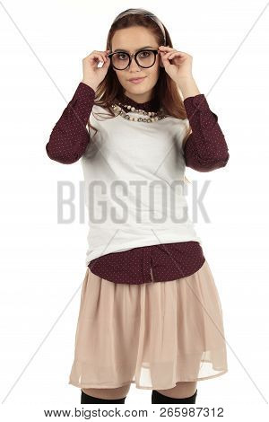 Day Dreaming Preppy Girl Look Into The Distance With A Pink Skirt And White T-shirt