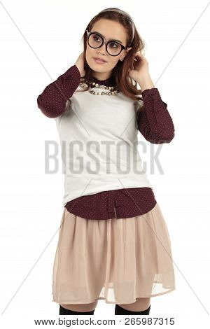 Day Dreaming Preppy Girl Look Into The Distance With A Pink Skirt And White T-shirt
