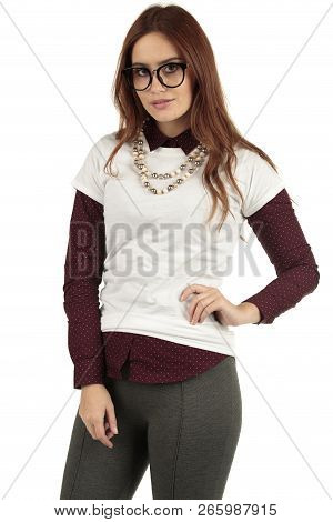 Cute Smiling Preppy, Fashion Geek Girl In A White T-shirt And Maroon Blouse