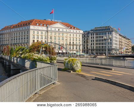 Geneva, Switzerland - September 24, 2016: Pont Des Bergues Bridge Over The Rhone River, Buildings Of