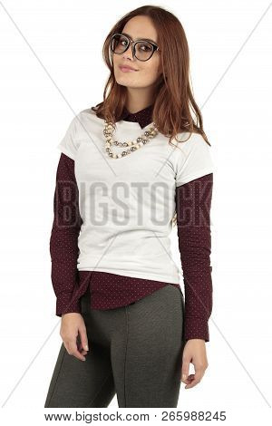 Cute Smiling Preppy, Fashion Geek Girl In A White T-shirt And Maroon Blouse