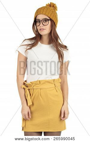 Cute Smiling Preppy, Fashion Geek Girl In A White T-shirt And Yellow Skirt