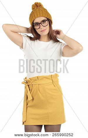 Cute Smiling Preppy, Fashion Geek Girl In A White T-shirt And Yellow Skirt