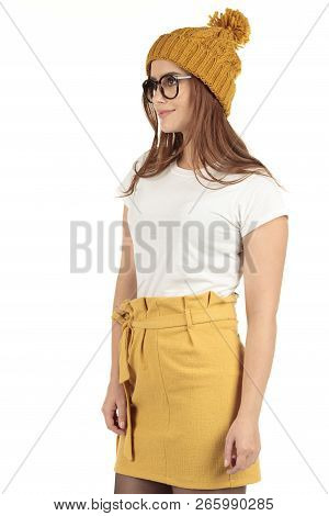 Cute Smiling Preppy, Fashion Geek Girl In A White T-shirt And Yellow Skirt