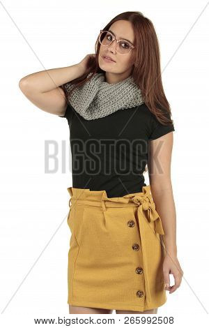 Cute Smiling Preppy, Fashion Geek Girl In A Black T-shirt And Yellow Skirt