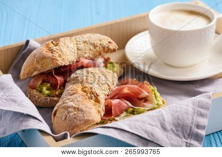 Sandwiches With Ham And Avocade Spread, On Wooden Tray.
