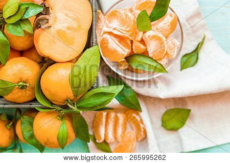 Healthy Diet Concept. Fresh Ripe Persimmons And Tangerines On White Wooden Background Top View Flt L