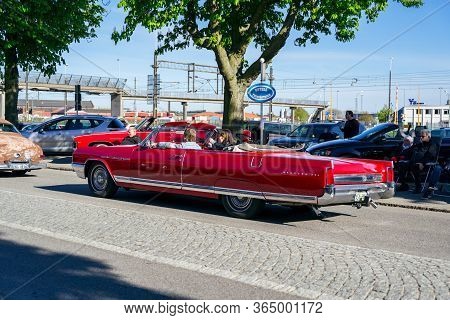 Ystad, Sweden - May 14 2019: Classic Cars Cruising In The City At Summer Meet . Lots Of People Stand