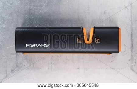 Warsaw, Poland - March 9, 2020:black Fiskars Sharpener For Knives On A Gray Steel Background.