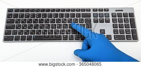Disinfection In Public Places, The Fight Against The Virus, Coronavirus. A Working Hand In A Rubber 