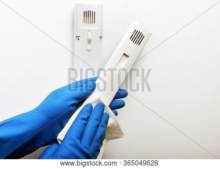 Disinfection In Public Places, The Fight Against The Virus, Coronavirus. The Working Hand Wipes The 
