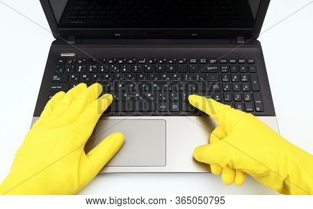 Disinfection In Public Places, The Fight Against The Virus, Coronavirus. A Working Hand In A Rubber 