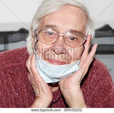 Elderly Woman In A Medical Mask