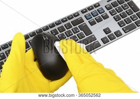 Disinfection In Public Places, The Fight Against The Virus, Coronavirus. A Working Hand Wipes A Comp