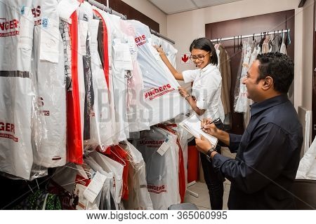 Johannesburg, South Africa - May 25, 2015: Small Business Owners Of Local Dry Cleaning Franchise Che