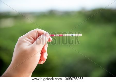 Positive Pregnancy Test On Strip. Baby Coming Soon Concept.