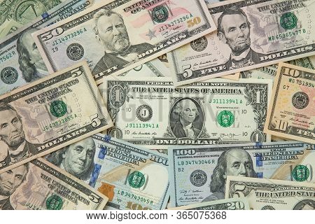Money American Hundred Dollar Bills Pile Of Various Currencies Isolated On White Background. Closeup