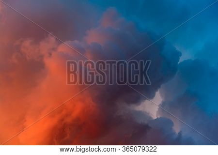 Dramatic Sky With Bright Red And Dark Blue Stormy Clouds. Nature Background