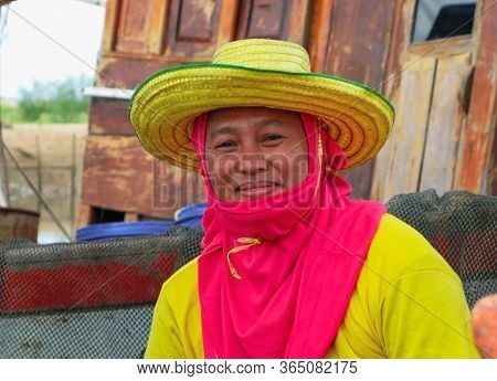 Chumporn, Thailand, 28 November 2019 Close Up Of Fisherman Woman With Colorful Of Yellow T-shirt And