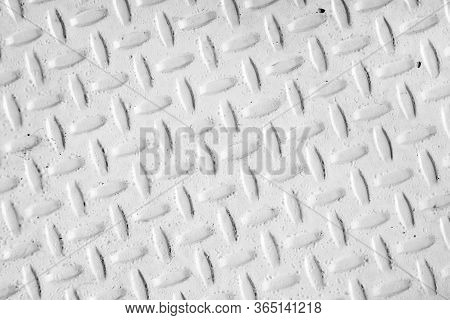 Steel Dirty And Used Checker Plate Metal Sheet. Can Be Use As Background Or Texture.