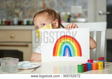 Thank To Nhs. Kid In Protective Mask Painting The Rainbow During Covid-19 Quarantine At Home. Corona