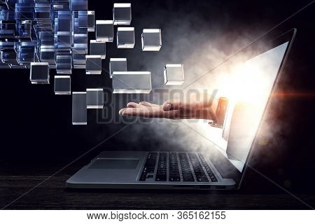 Hand holding glowing cubes. Innovation and creativity concept.