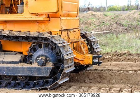 Industrial Building Construction Site Bulldozer Leveling And Moving Soil During Highway Building. Ye
