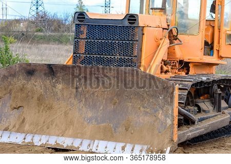 Industrial Building Construction Site Bulldozer Leveling And Moving Soil During Highway Building. Ye