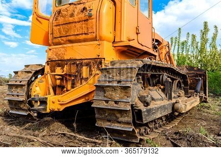 Industrial Building Construction Site Bulldozer Leveling And Moving Soil During Highway Building. Ye