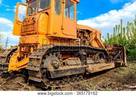Industrial Building Construction Site Bulldozer Leveling And Moving Soil During Highway Building. Ye