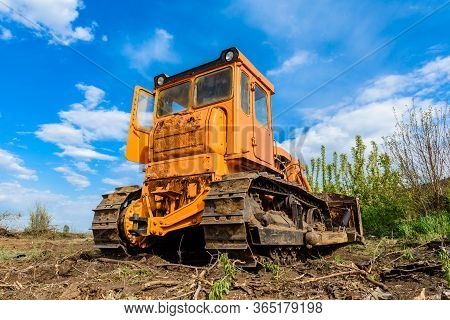 Industrial Building Construction Site Bulldozer Leveling And Moving Soil During Highway Building. Ye