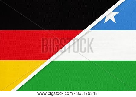 Federal Republic Of Germany Vs Puntland State Of Somalia, Symbol Of Two National Flags From Textile.