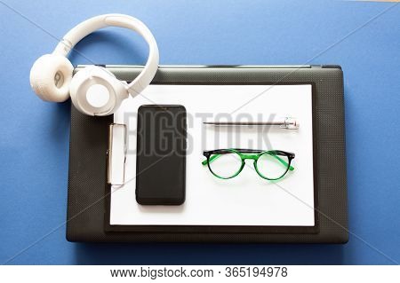 On A Laptop Are Paper Pen Glasses Glasses Smartphone, Mobile Office, Remote Work