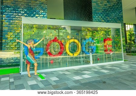 Singapore - May 5, 2018: Tourist Playing With The Interactive Google Sign In The Main Building New G