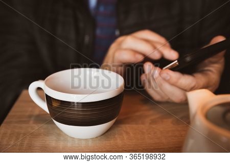 Man's Hands With A Smartphone