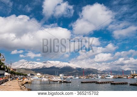 Sea Landscape Of Gaeta With Cloudy Sky And Snowy Mountains On Background. Gaeta Is A Small Medieval 