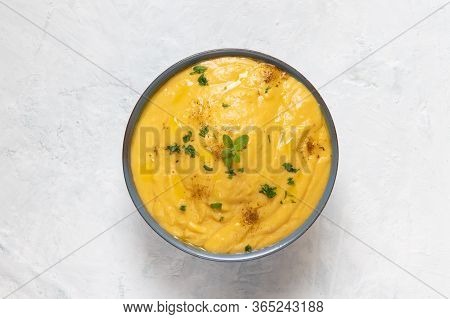 Vegeratian Red Lentil Creamy Soup In Bowl On Gray Stone Background, Top View, Close Up