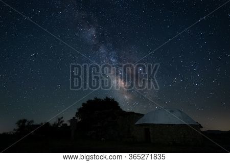 Night Landscape With Milky Way In The Natural Park Of Barruecos. Extremadura. Spain.