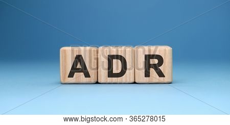 Adr Word Cube On A Blue Background. Business Concept.