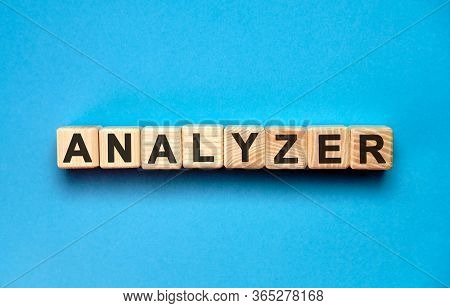 Analyzer - Seo Business Text With Wooden Cubes On A Blue Background